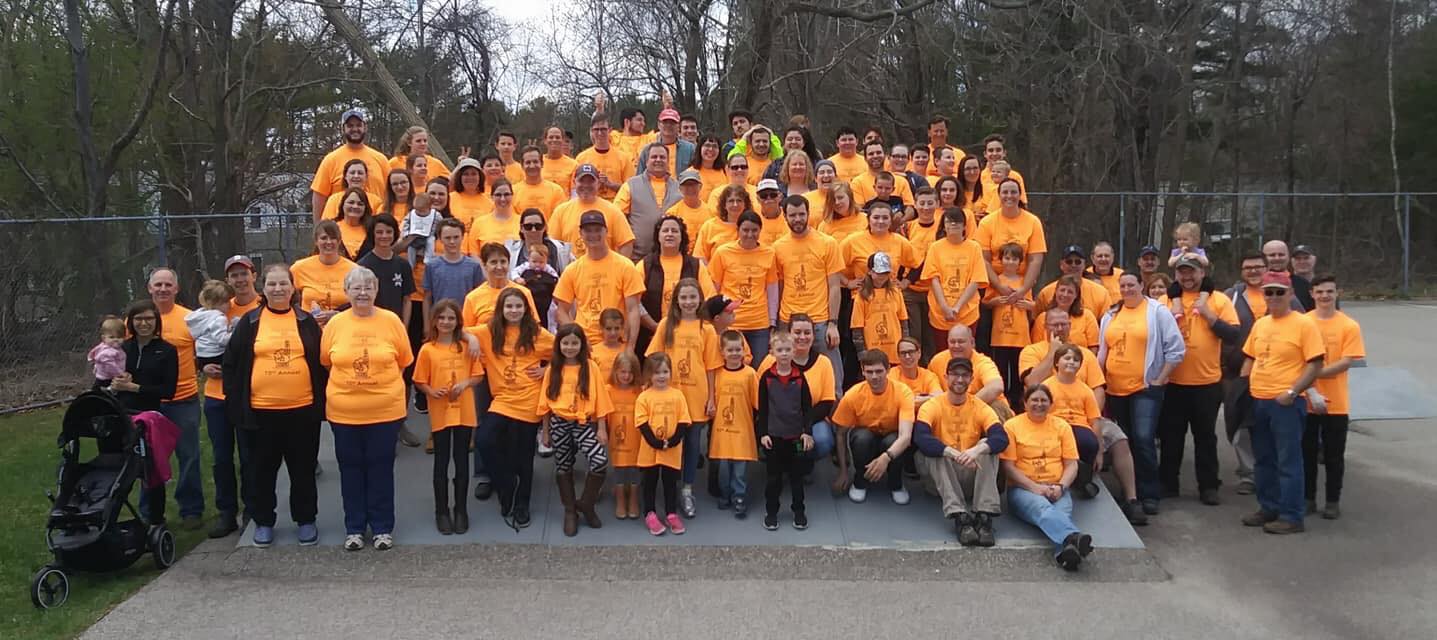 People at One Day to Serve wearing T-Shirts for a group photo